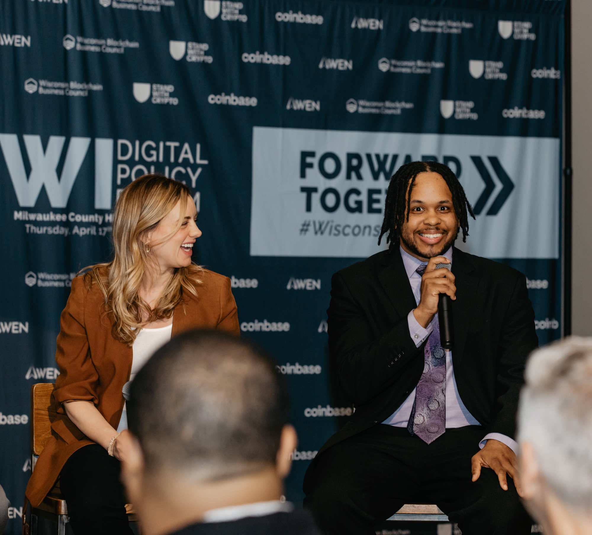 Maggie Schmidt on the Wisconsin Digital Policy Forum panel in front of the branded Forward Together backdrop